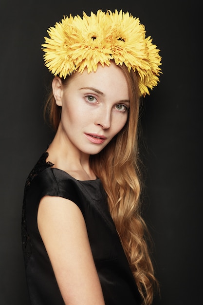 Beautiful young woman portrait on black background