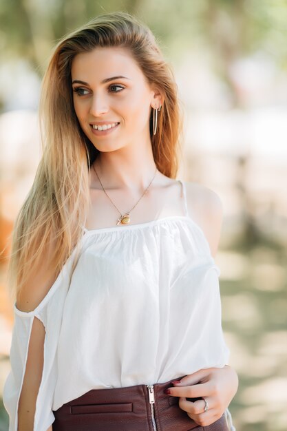 Beautiful young woman portrait outdoor in the park