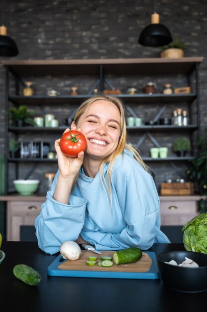 Beautiful young woman posing in the kitchen