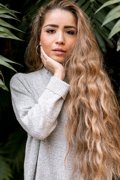 Beautiful young woman posing outside