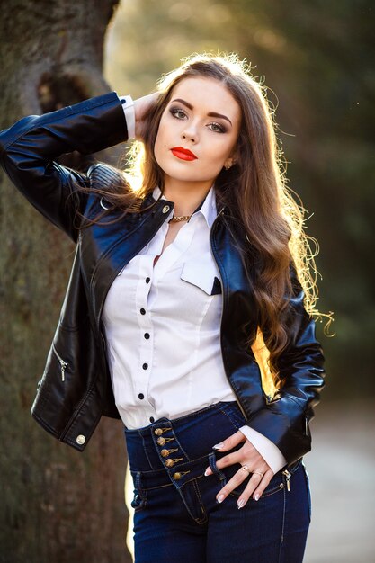 Beautiful young woman posing in the park