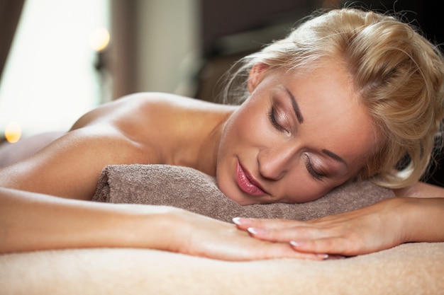 Beautiful young woman relaxing in a spa 