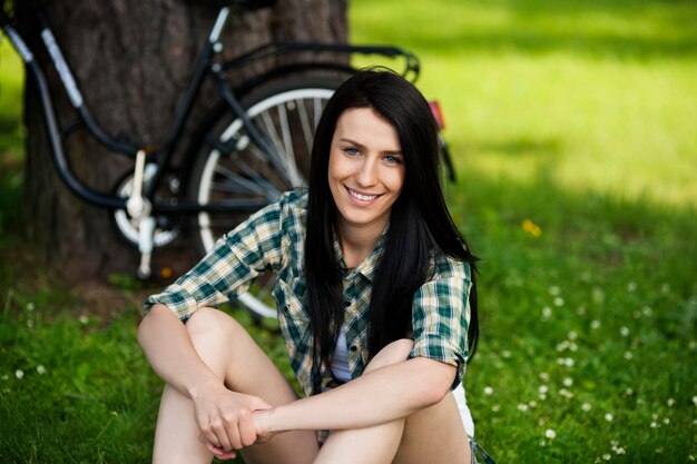 Beautiful young woman resting in park