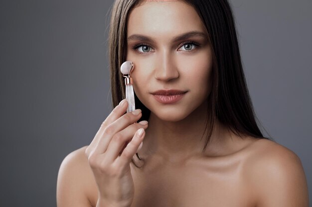 beautiful young woman in studio portrait skin care