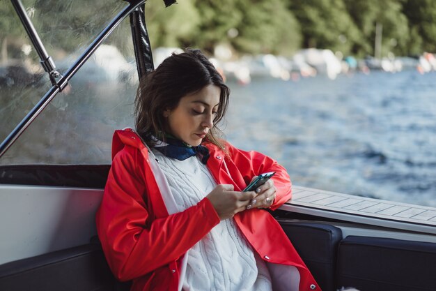 beautiful young woman taking pictures on a smartphone