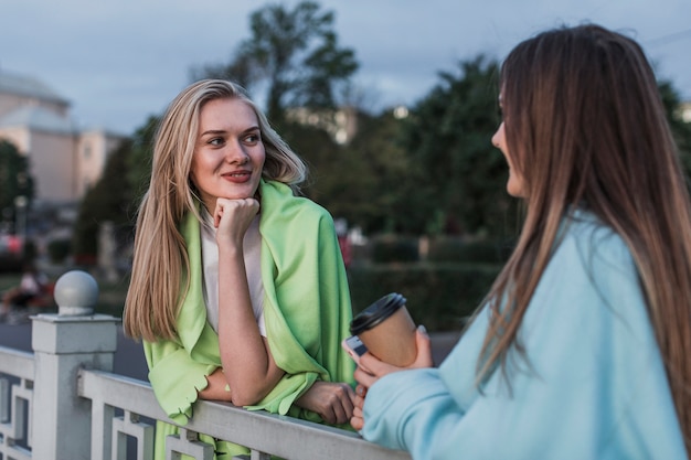 Free photo beautiful young woman talking  to each other