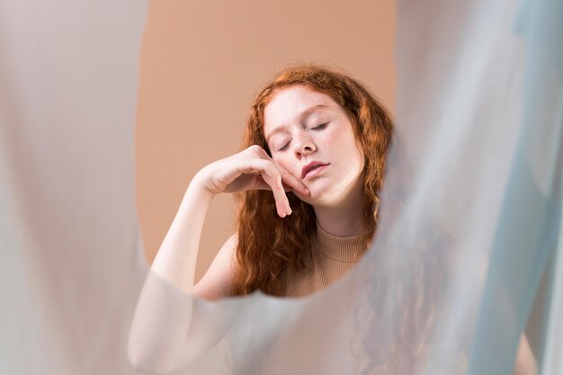 Beautiful young woman teaching sign language