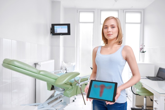 Beautiful young woman visiting doctor