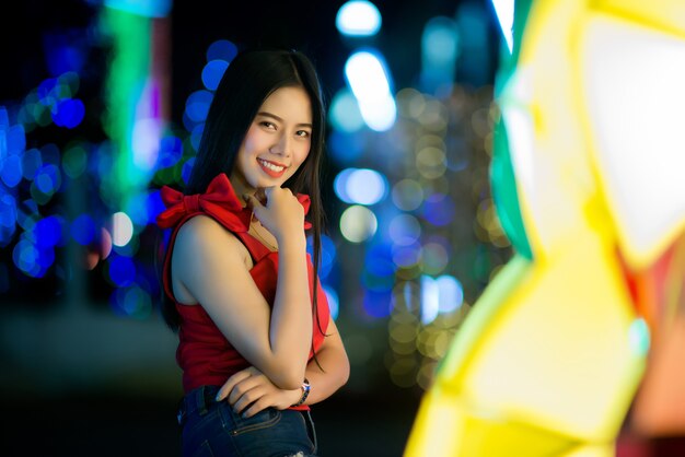 Beautiful young woman walking in the street 