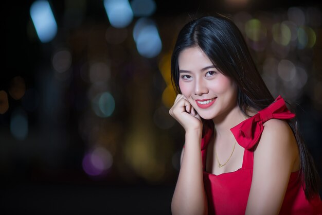 Beautiful young woman walking in the street 