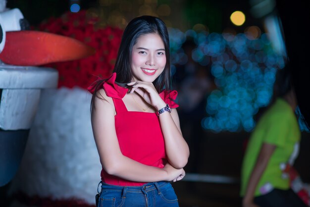 Beautiful young woman walking in the street 