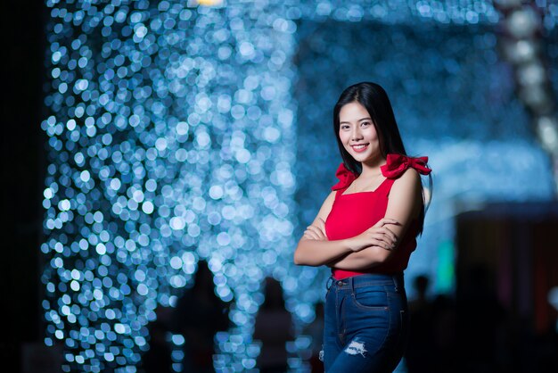 Beautiful young woman walking in the street 