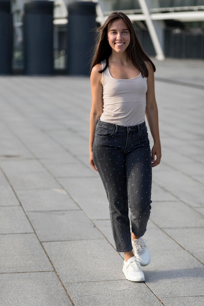 Free photo beautiful young woman walking