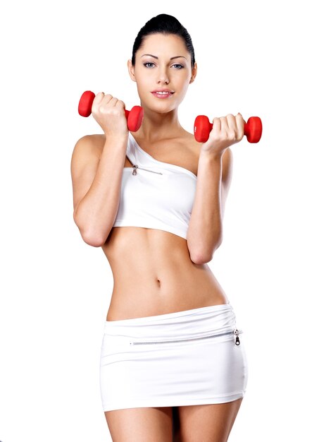 Beautiful young woman with dumbbells -Healthy lifestyle concept.
