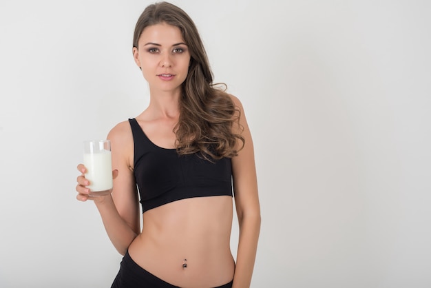 Beautiful young woman  with glass milk