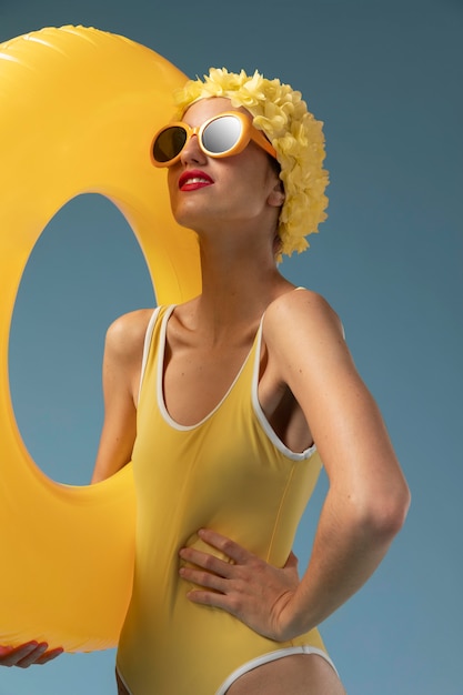 Beautiful young woman with swimming cap