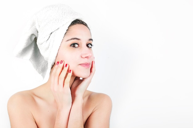 Beautiful young woman with wrapped towel around her neck