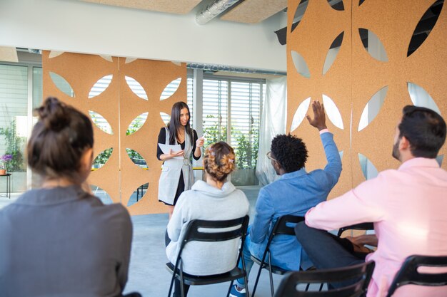 Beautiful young woman working with audience