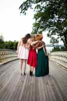 Free photo beautiful young women in their graduation dresses