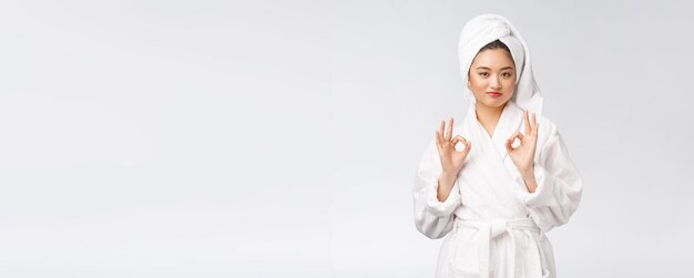 Beauty asian woman ok gesture for good facial product isolated on white background beauty and fashion concept