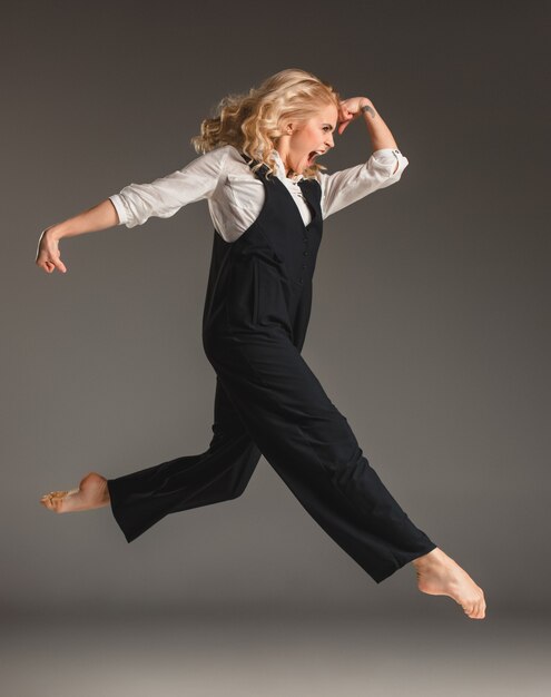 Beauty blond woman in ballet jump