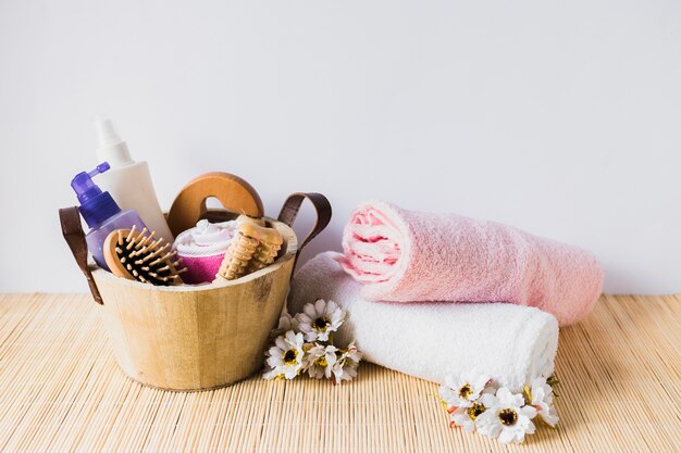 Beauty concept with bucket and towels