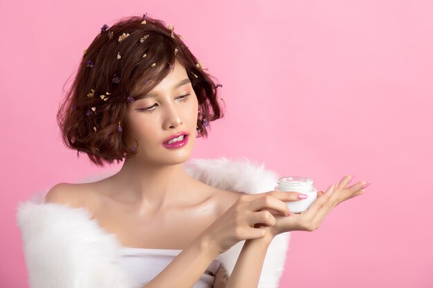 Beauty Concept. woman holds a moisturizer in her hand