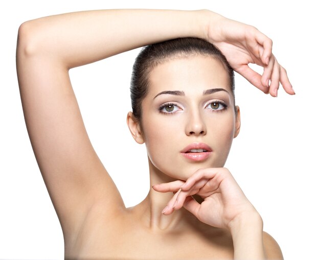 Beauty face of young woman. Skin care concept. Closeup portrait isolated on white.