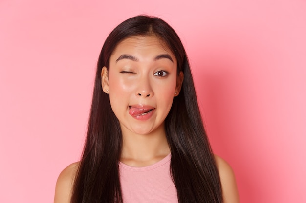 Beauty fashion and lifestyle concept closeup of cute and silly kawaii asian girl making funny faces ...