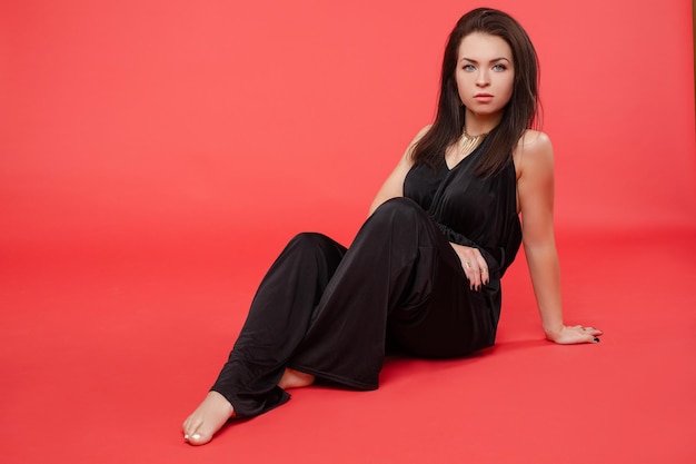 Beauty girl in fashionable black overall