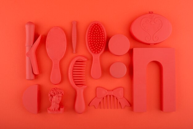 Beauty items on coral background