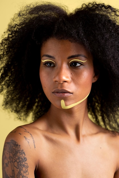 Beauty portrait of afro woman with ethnic makeup