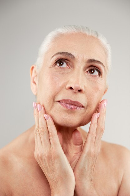 Beauty portrait of an attractive naked elderly woman