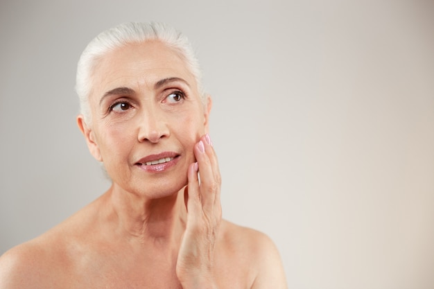 Beauty portrait of an attractive naked elderly woman