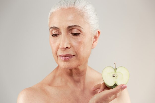 Beauty portrait of a beautiful half naked elderly woman