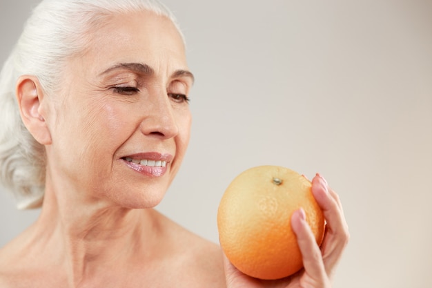 Beauty portrait of a lovely half naked elderly woman