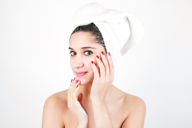 Beauty portrait of a woman with towel wrapped around her head