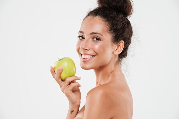 Beauty portrait of a young smiling woman with soft skin