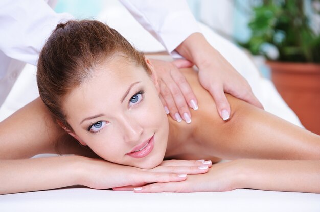Beauty serene woman getting relaxation in the spa salon