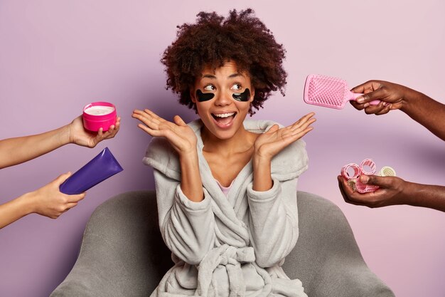 Beauty spa woman with curly hairstyle, wears domestic clothes