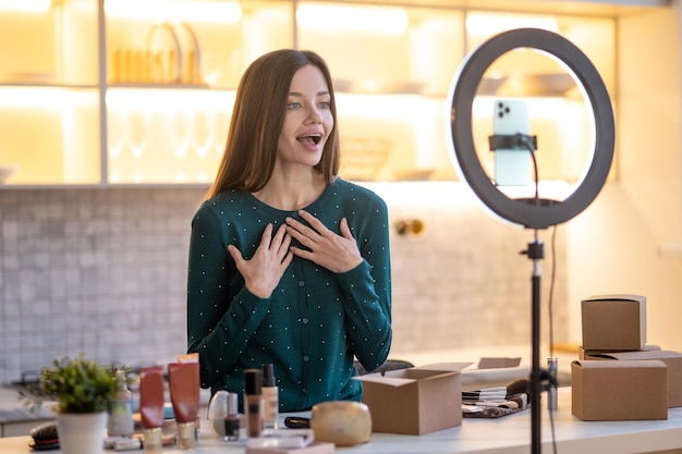 Beauty tutorial. Pretty young woman telling the online audience about beauty tips