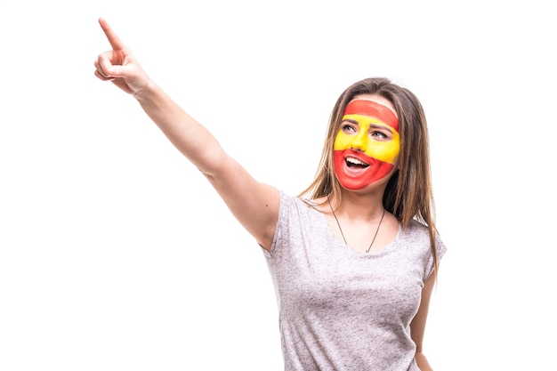 Beauty woman supporter fan of Spain national team painted flag face get happy victory screaming pointed hand. Fans emotions.