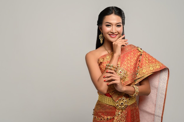 Free photo beautyful thai woman wearing thai dress