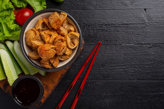 Beef ball fried on the dark wooden surface.