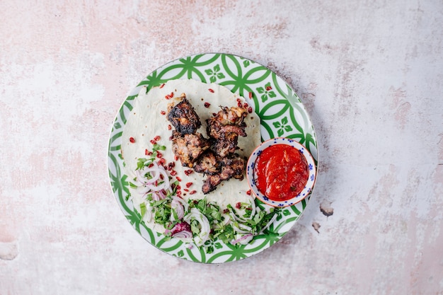 Beef barbecque, kebab, with bbq sauce, herbs and onion.