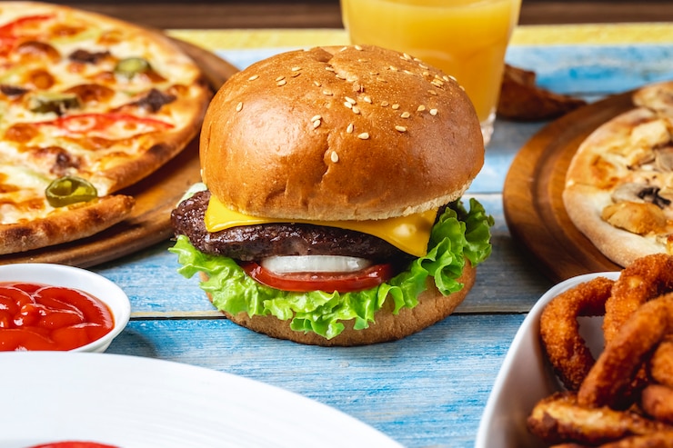Free Photo beef burger meat lettuce tomato cheese side view