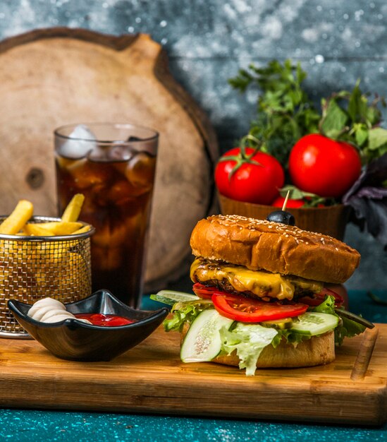 beef burger served with french fries, mayonnaise and ketchup