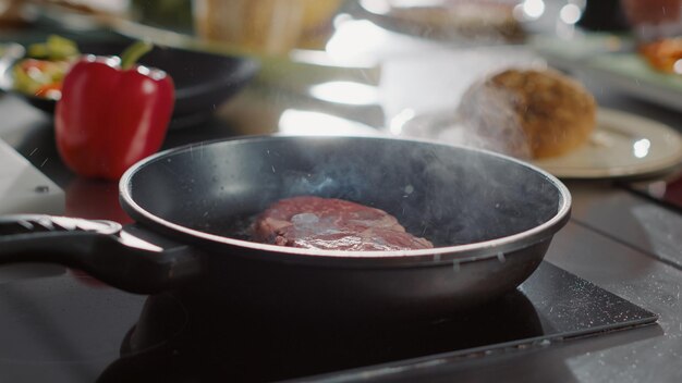 Beef meat cooked with organic sunflower oil in frying pan