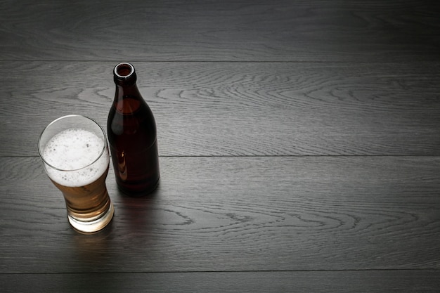 Beer bottle and glass with copy space
