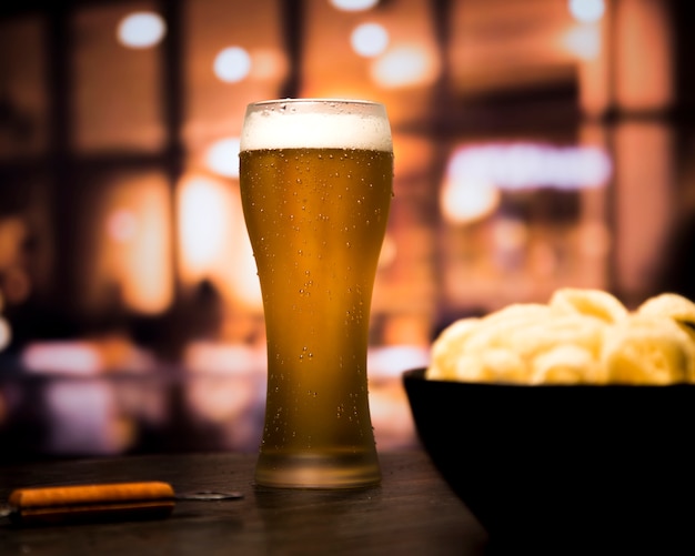 Beer glass in front of blurred background